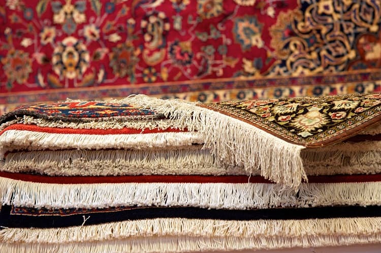 Oriental rug with fringes.